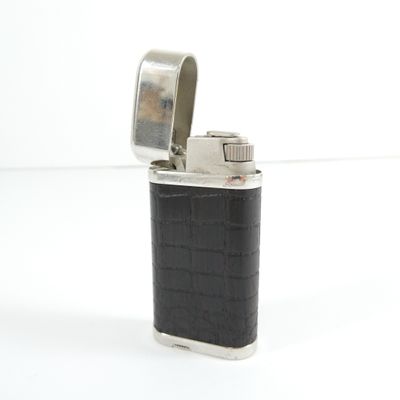 a lighter that is sitting on a white surface