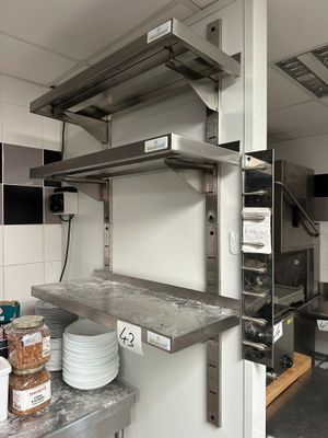 an image of a commercial kitchen with stainless steel shelvings