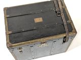 an old trunk that is sitting on a white surface