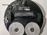 an image of a robotic vacuum cleaner with two wheels