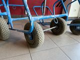 a blue cart that is sitting on the floor