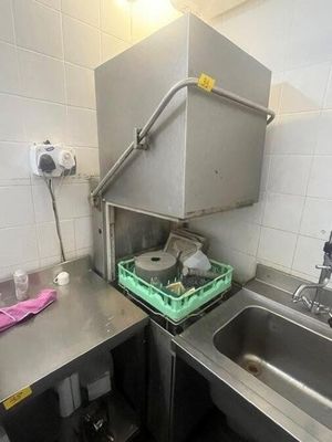 a small kitchen with a sink and a dishwasher