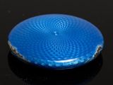 a blue frisbee sitting on top of a black surface