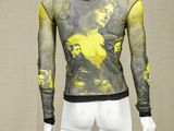 a mannequin wearing a yellow and black shirt with a picture of a man on it