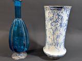 two vases sitting next to each other on a table