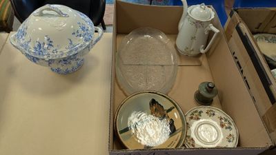 a box that has a bunch of plates and bowls in it