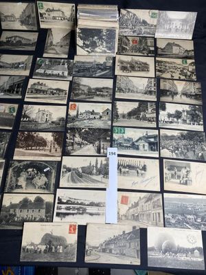 many old black and white photos are on display on a table