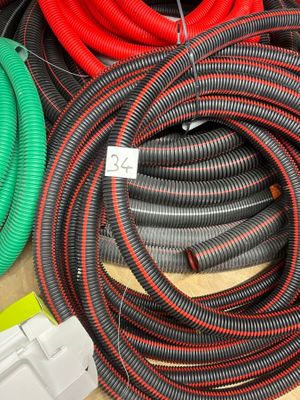 several different colored hoses are lined up on a table