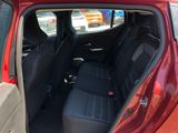a red car with black seats in the back of it