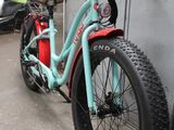 a bike that is parked next to a wall
