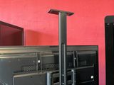 two televisions and a monitor in a room