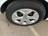 a close up of a tire on a car ' s rim