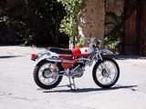 a red motorcycle parked on the side of the road