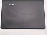 a black laptop sitting on top of a white table