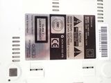 a label on the back of a white electronic device