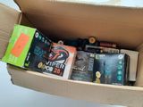 a cardboard box filled with assorted items on a table