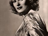black and white photograph of a woman in a dress posing for a picture