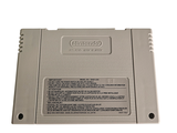 a nintendo game console sitting on top of a white table