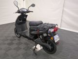 a scooter that is parked in a room