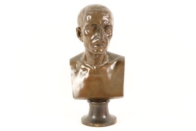 bronze bust of a man on a pedestal on a white background
