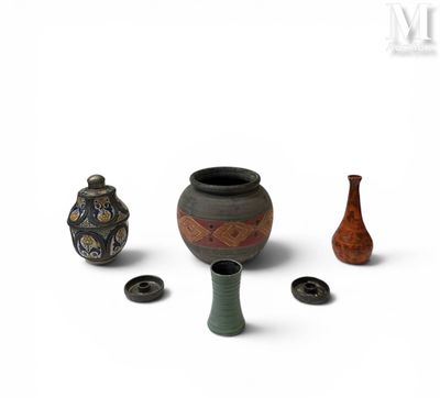 three vases that are next to each other on a white surface