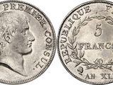 a silver coin with a portrait of a man on it