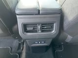 the interior of a car with a console and air conditioning system