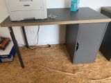 a computer desk with a printer on top of it