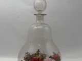 a glass vase with flowers inside of it on a table