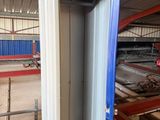 a large open door in a building that is being built