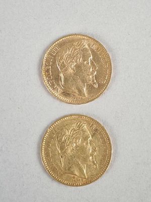 two gold coins with a man ' s face and a woman ' s face on them