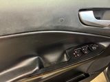 the interior of a car with the door open showing the control panel