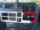 a close up of a car dashboard with a red and black sticker on it
