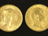 a close up of two gold coins on a black surface