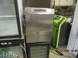 two refrigerators that are sitting next to each other in a room
