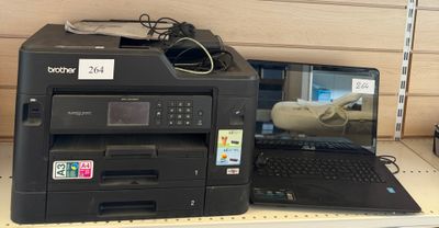 a printer and a laptop on a shelf in a store