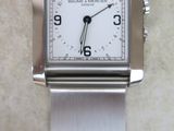 a watch that is sitting on a white surface