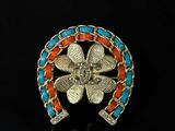 an image of a gold and turquoise broochle ring
