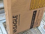 a cardboard box sitting on top of a metal shelf