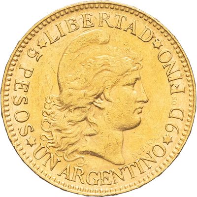 Gros plan sur une pièce d'or ornée d'une tête de femme