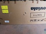 a cardboard box with a bunch of shoes on top of it