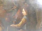 un tableau représentant une femme assise à une table avec d'autres personnes