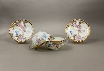 three pieces of porcelain with flowers and birds on them