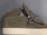 a close up of a pair of shoes with a zipper on the side