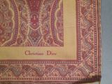 a close up of a red and yellow paisley print pocket square