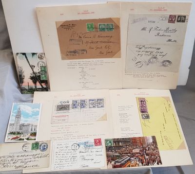an open suitcase filled with lots of old postcards sitting on top of a table