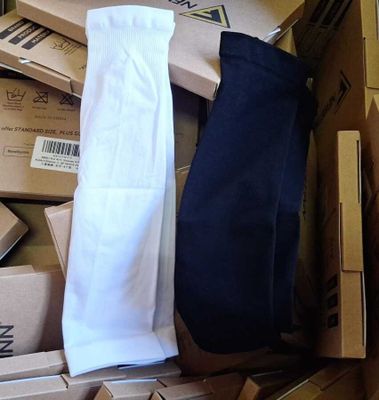 a box full of boxes of clothing and a pair of socks