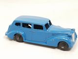 a blue toy car that is sitting on a white surface