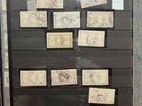 a picture of a display of stamps on a glass case