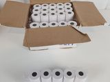 several rolls of toilet paper in a box on a table